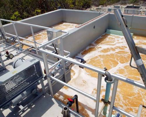 Looking into murky water stored in concrete structure